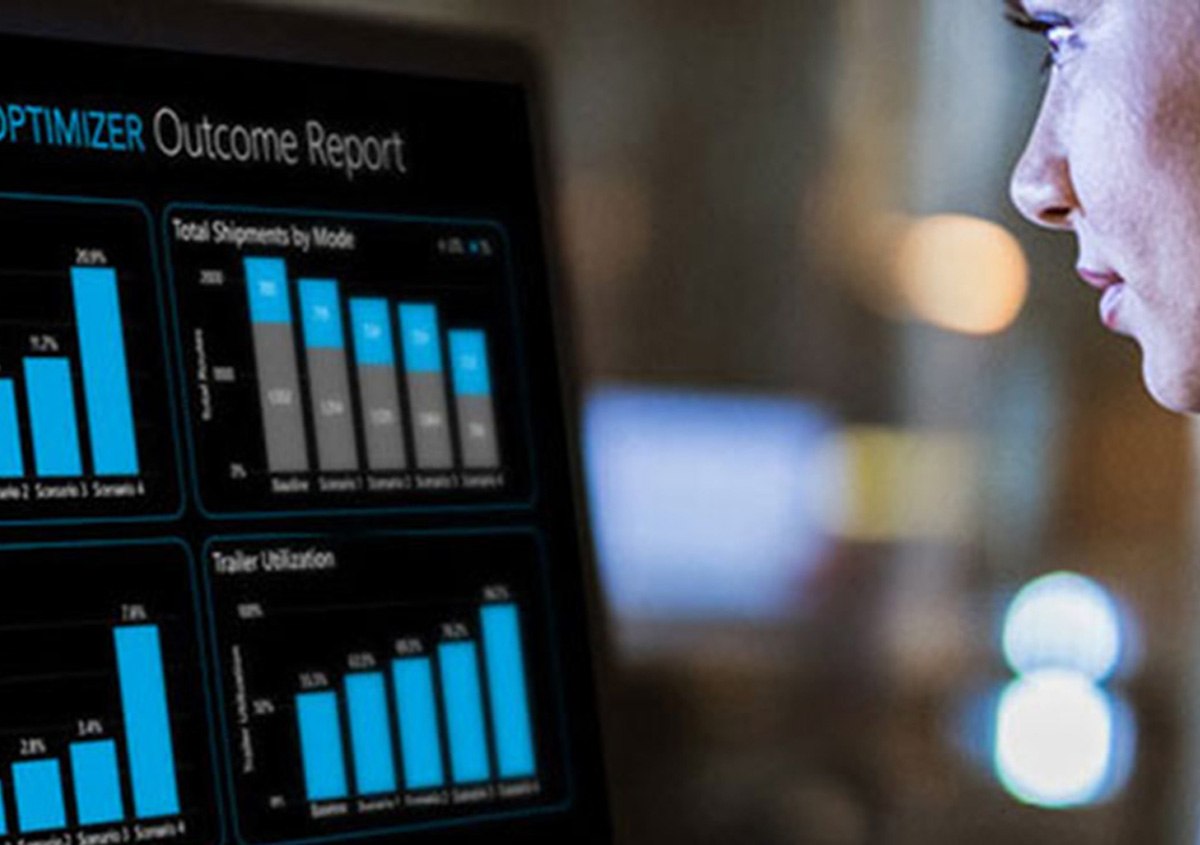 Person with laptop, on their phone ordering groceries. 