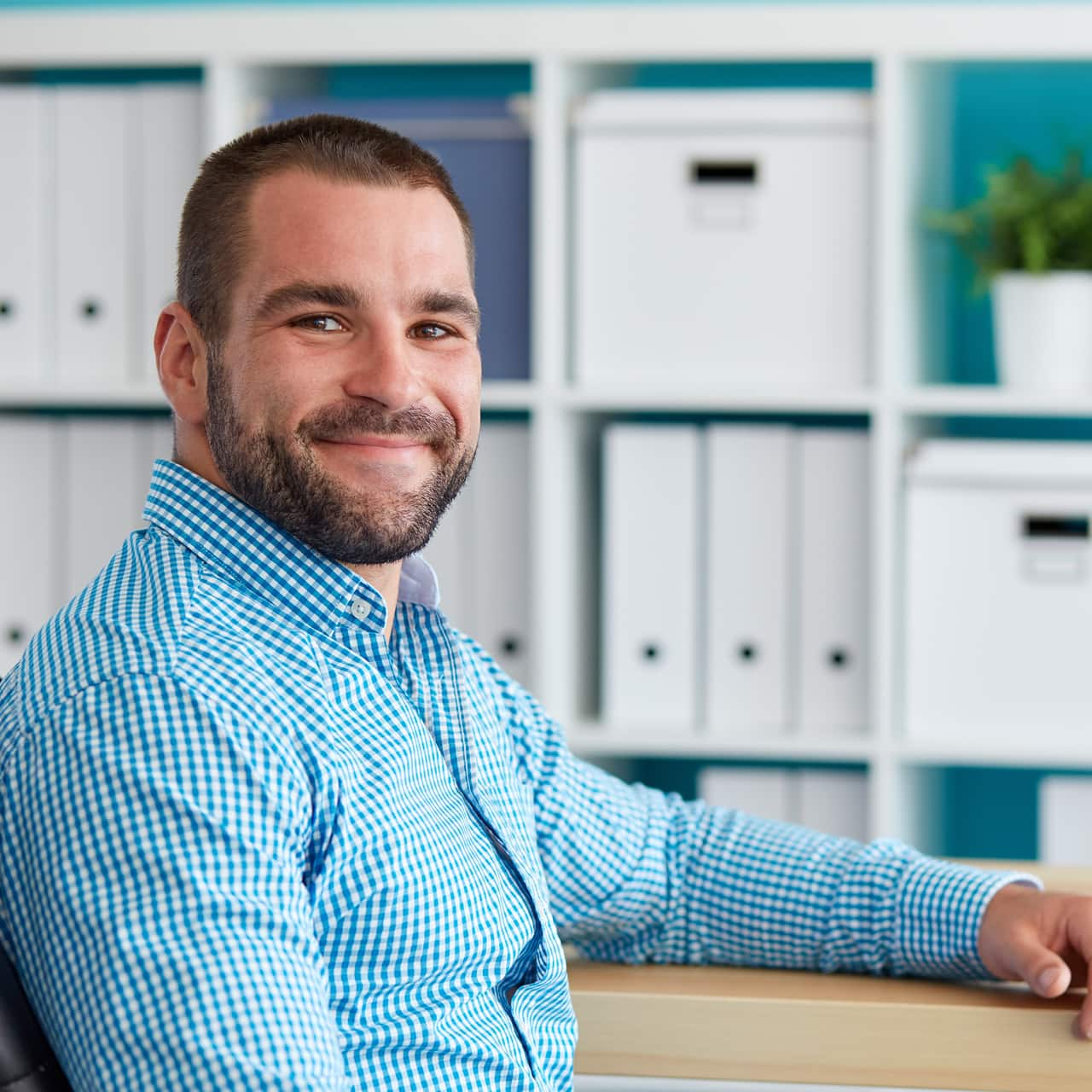 Male interviewee smiling at the camera