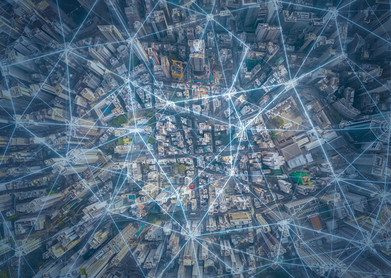 City overview with digital lines pin pointing locations.