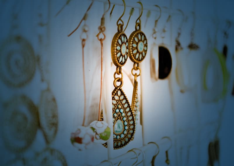 Close up of drop earrings with blue overlay | Retail logistics solutions by C.H. Robinson