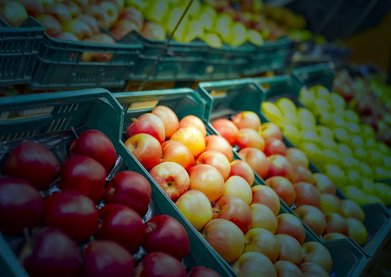 Close up of apple produce with blue overlay | Retail logistics solutions by C.H. Robinson