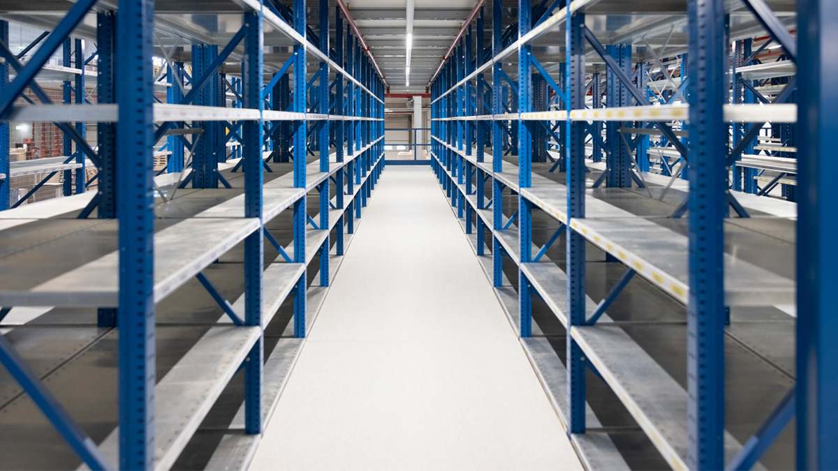 Empty warehouse with blue shelves